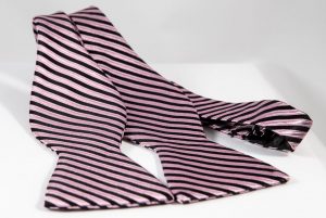 Silk 2.5" pink bow tie with black stripes, untied